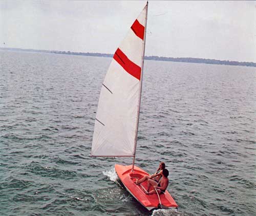 Young Couple Sailing in a 1973 Sprite Daysailer from Duo.