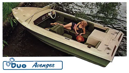 Duo Avenger - Stern Drive, Wide V Hull Shown Docked at Shoreline With Girl in Bathing Suit.