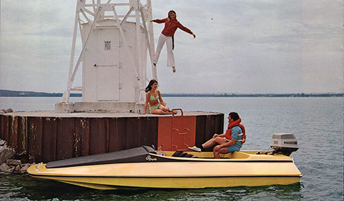 Duo Mystery-17 Sporty Speedboat with Outboard and Tunnel Hull Shown Docked at a Diving Platform With Several Young Adults.