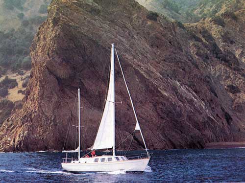 Cruising Along the Shoreline in a Cal 2-46 Yacht.