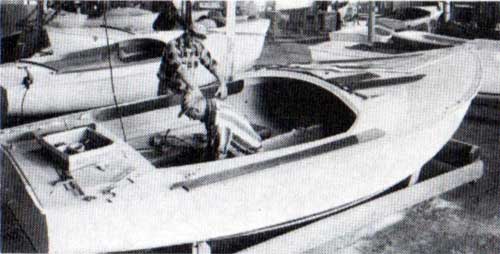 Experienced Joiners Work on an O'Day Sailboat.
