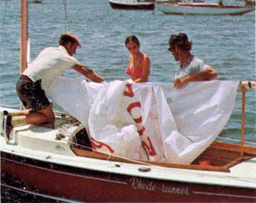 GGA Image ID # 23f73d8363 Stowing the Main Sail on the Rhodes 19.