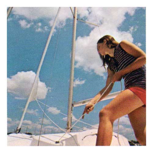 Young Woman rigging an O'Day Day Sailer II Sailboat.