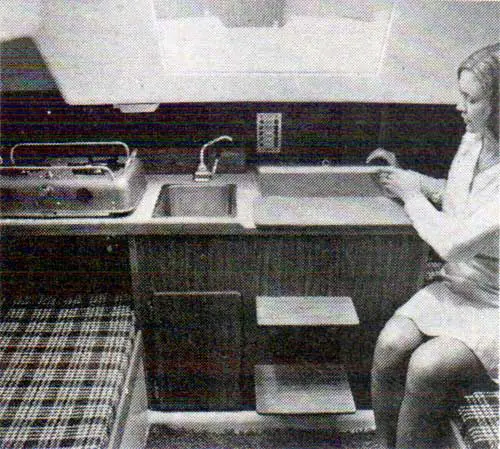 Woman Sits in a O’day 25 Galley Looking Aft.