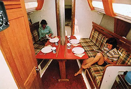 GGA Image ID # 240342c7c4 Relaxing in Galley and Setting the Table for a Meal on the O'Day 32 Aft-Cabin.