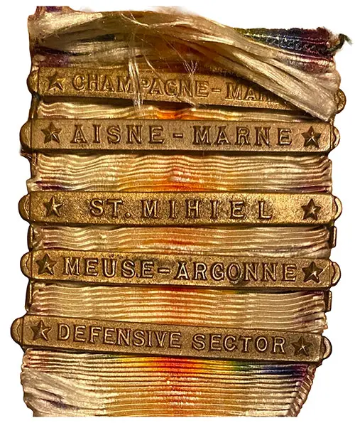 Campaign Clasps Were Attached to the Ribbon to Denote Specific Battles or Duties. This Image Include Battle Clasps for Champagne-Marne, Aisne-Marne, St. Mihiel, Meuse-Argonne, The World War I Victory Medal "Defensive Sector" Battle Clasp was awarded for general defense service in a specific area during World War I.