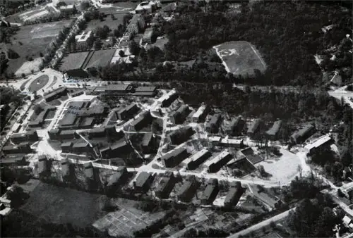Air View of Wave Quarters “D” Reveals Its Well-Planned Pattern, Which Is Harmonious With Barracks, Crosswalks, and the Key Administration, Recreation, and Commissary With the Ordered Design of Washington. “D” Is a Community Complete With Streets Connecting Barracks and Buildings. at the Upper Left Is the Familiar Ward Circle.