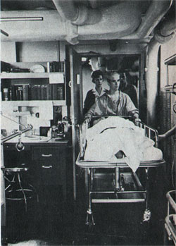 At Work—Navy Nurse Crosby Escorts Patient From Recovery Ward.