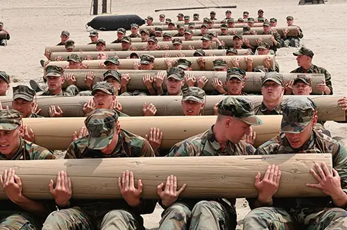 First Phase Basic Underwater Demolition/SEALs (BUD/S) Candidates Use Teamwork to Perform Physical Training Exercises With a 600-Pound Log at Naval Amphibious Base Coronado on April 6, 2011.