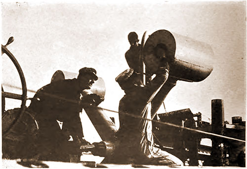GGA Image ID # 18a6022347 Adjusting Timing Mechanism on Depth Charge Just before Firing " Y " Gun.