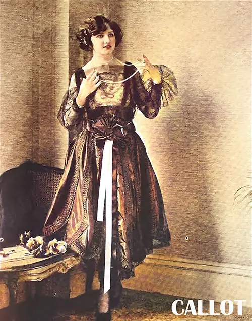 GGA Image ID # 2180b6497f A Callot Dinner Gown of Lustrious Black Satin Cleverly Lined With Sheer Black Lace in Pleasing Harmony of Tone and Design.