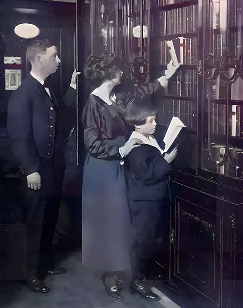 First Class Passengers Select Reading Materials from the Library on a White Star Line Steamship circa 1909.