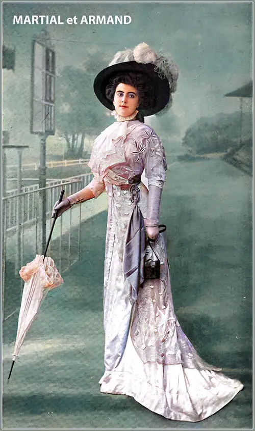 Afternoon Gown by Martial Et Armand. The dress is made of Embroidered Net in Canary and White. The net Forms an Oversized Frock Coat Over a Skirt in Liberty Yellow, Accented With a Crimson Sash.