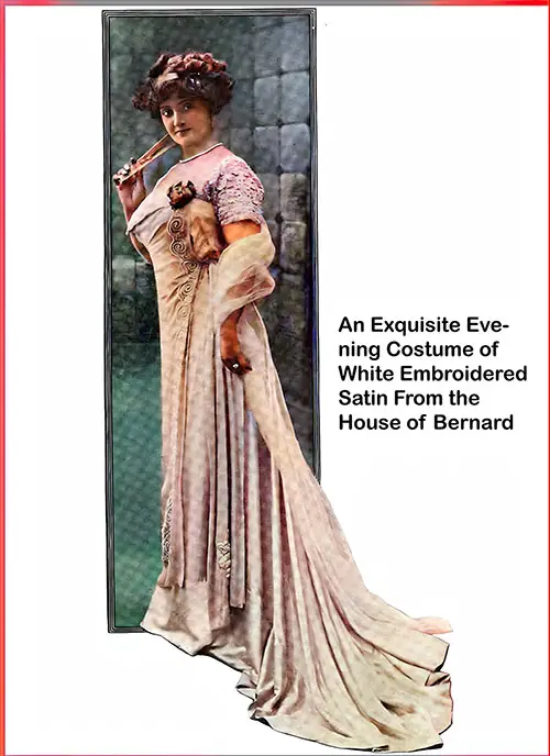 An Exquisite Evening Costume of White Embroidered Satin From the House of Bernard.