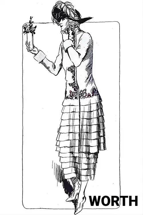 Worth Makes a Delightful Costume With the Basque Coat, Flat Ruffles of Gray Wool, and Rust-Colored Embroidery on the Coat.