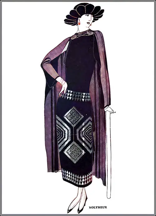 This Striking Cape Costume From Molyneux Is Made of Black Silk Jersey. The Dress Features Machine-Embroidered Tarnished Silver Accents, and the Cape Is Secured With Silver Plaques.