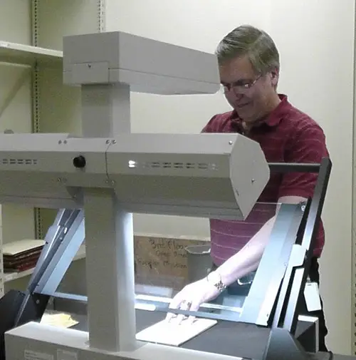 Paul Gjenvick, GG Archives Archivist, Scanning Documents in 2013.