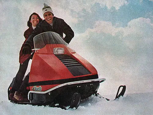 Young Couple on Alouette Snowmobile