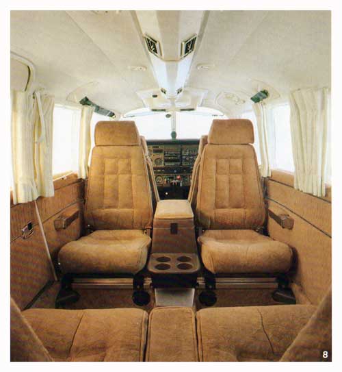 Contoured, reclining seats are color coordinated with plush carpeting and padded side panels. - 1980 Brochure