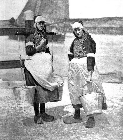 The Daughters Of The Dykes—two Dutch Peasant Girls In Characteristic Costumes. 