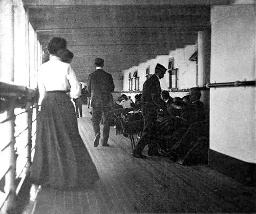 Steward Serving Tea While First Saloon Passengers Stroll by on the Shelter Deck
