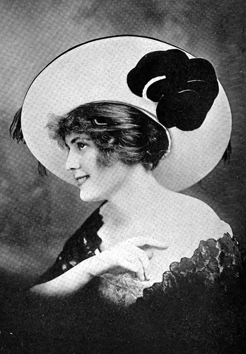 Portrait Hat in Black and Cameo Pink. the Velvet Covering the Wide Brim Is Overlaid With Ostrich Fringe and Trimmed With a Large-Petaled Velvet Flower.