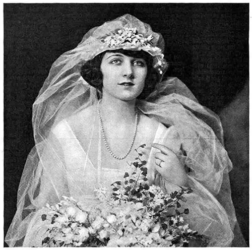 The Bride Wearing Her Bridal Jewelry of a Gold Ring and Pearl Necklace