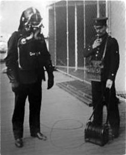 Fireman with Smoke Helment, Oxygen Tank and Attendant with Telephone