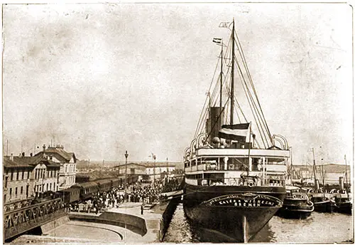The Ss Kaiser Wilhelm Ii at the Landing Stage in Bremen. People Are Gathered on the Landing Stage Shown on the Left.