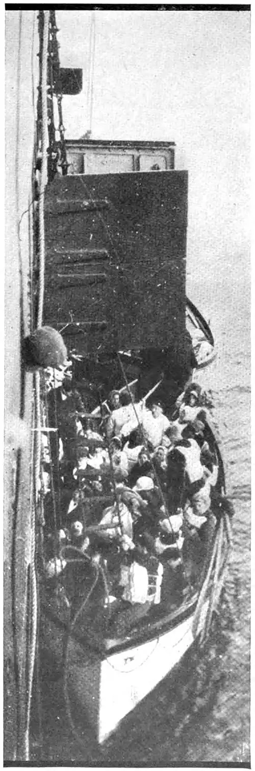 Taking the Titanic's Survivors on Board the Carpathia, Photographed from the Deck of the Carpathia.