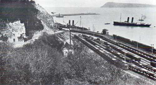 View of Fishguard Harbour circa 1913. Ward, Lock & Company Limited, London.