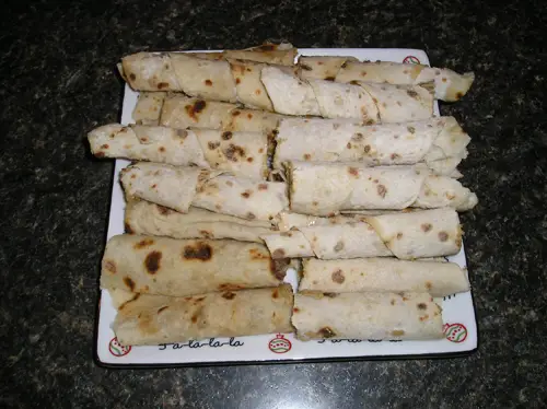 Step Four - Load up a Plateful of Prepared Lefse and Watch It Disappear Quickly.
