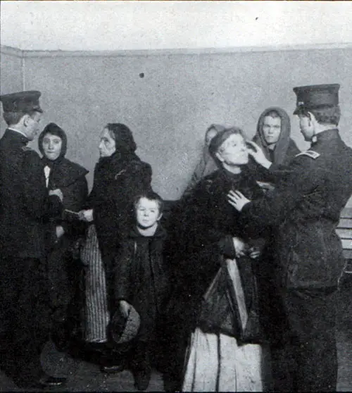 Immigrants being inspected at Ellis Island circa 1910.