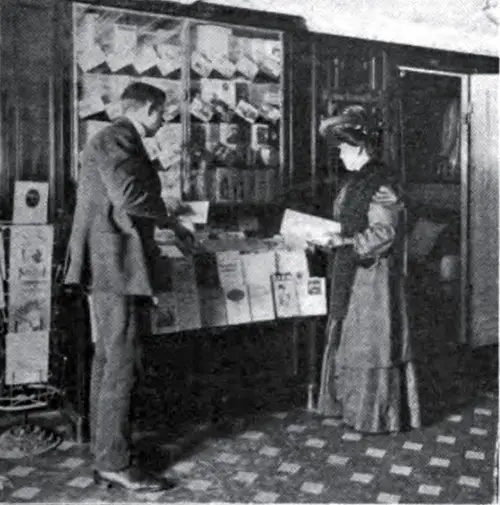 Couple browsing the book and pamphlets onboard a steamship (1910)