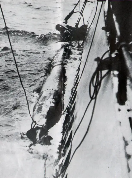 Torpedo alongside submarine recovered after being fired during target practice