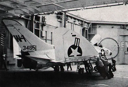 HANDLERS move F4D-1 to hangar deck of USS Bon Homme Richard (CVA 31).