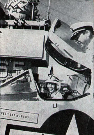 PHILIPPINE President Ferdinand Marcos tries out cockpit of an Enterprise A-4.