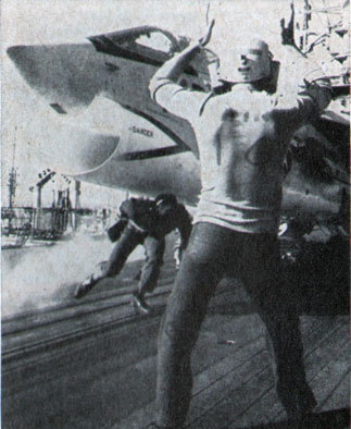 FLIGHT DECK action is fast aboard Hancock as Crusader is readied for launch.