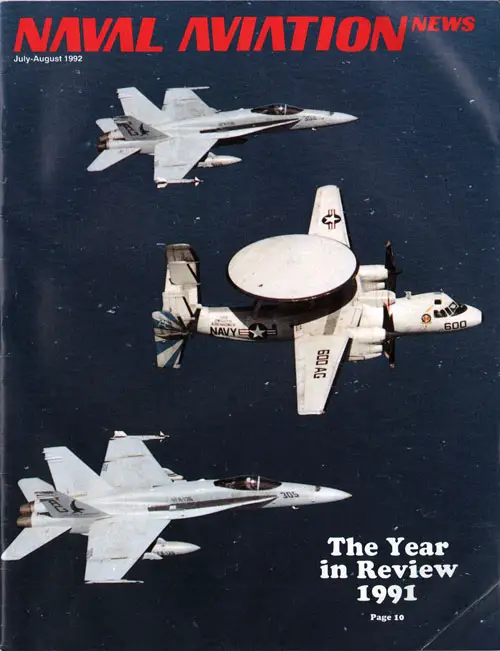 Front Cover, Naval Aviation News, August 1992: Two VFA-136 FA-18C Hornets escort a VAW-121 E-2C Hawkeye off the coast of Oman