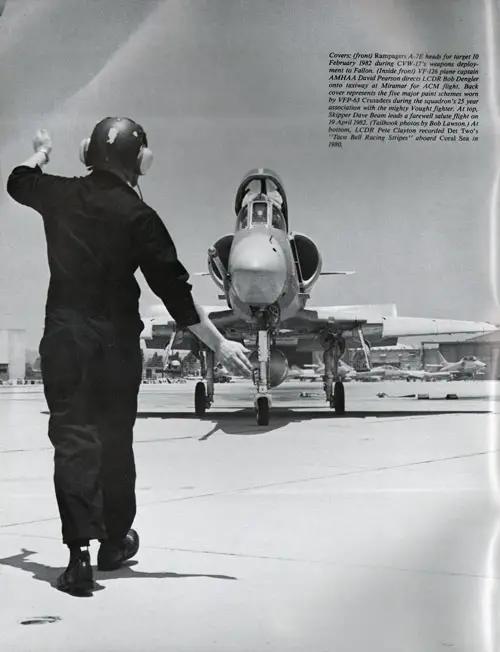 VF-126 plane captain AMHAA David Pearson directs LCDR Bob Dengler onto taxiway