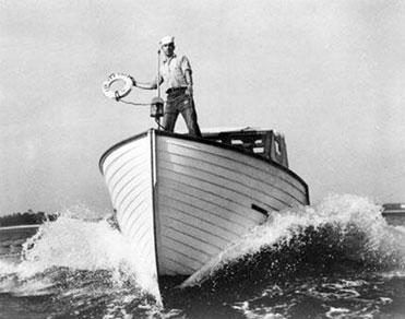 A Sailor Is Ready to Throw out A Life Preserver from the Crash Resuce Boat