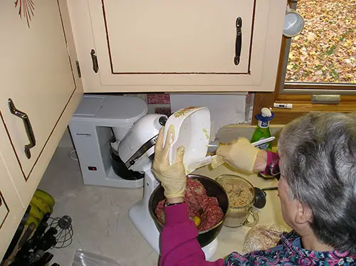 Using a Spatula To Aid in Scraping the Ingredients Out of the Bowl.