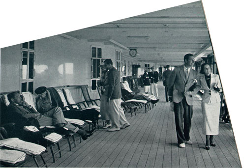 Passengers Enjoy Walking on the Promenade Deck of the RMS Empress of Britain. World Cruise 1936.