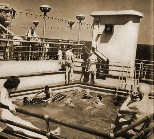 First Class Passengers Enjoy the Swimming Pools of the Cunard White Star.