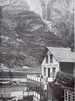 Photo 111: Scene of the Viking Hotel and Café showing a women dressed in traditional Norwegian costume or Bunad. 