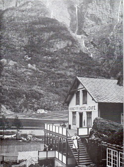 Photo 111: Scene of the Viking Hotel and Café showing a women dressed in traditional Norwegian costume or Bunad.