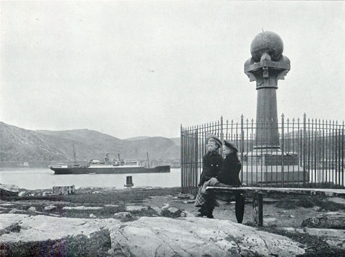 Photo 065: Children sitting on bench near the Meridian Column, Steamshp anchored in the Harbor at Hammerfest.