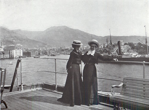 Photo 128 View of the SS Meteor and Two well-dressed women on the pier in Bergen, Norway. 
