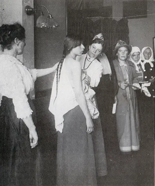 Female Physician Examines a Woman at Ellis Island.