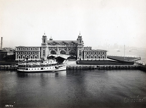 Boat Docked in Front of Ellis Island